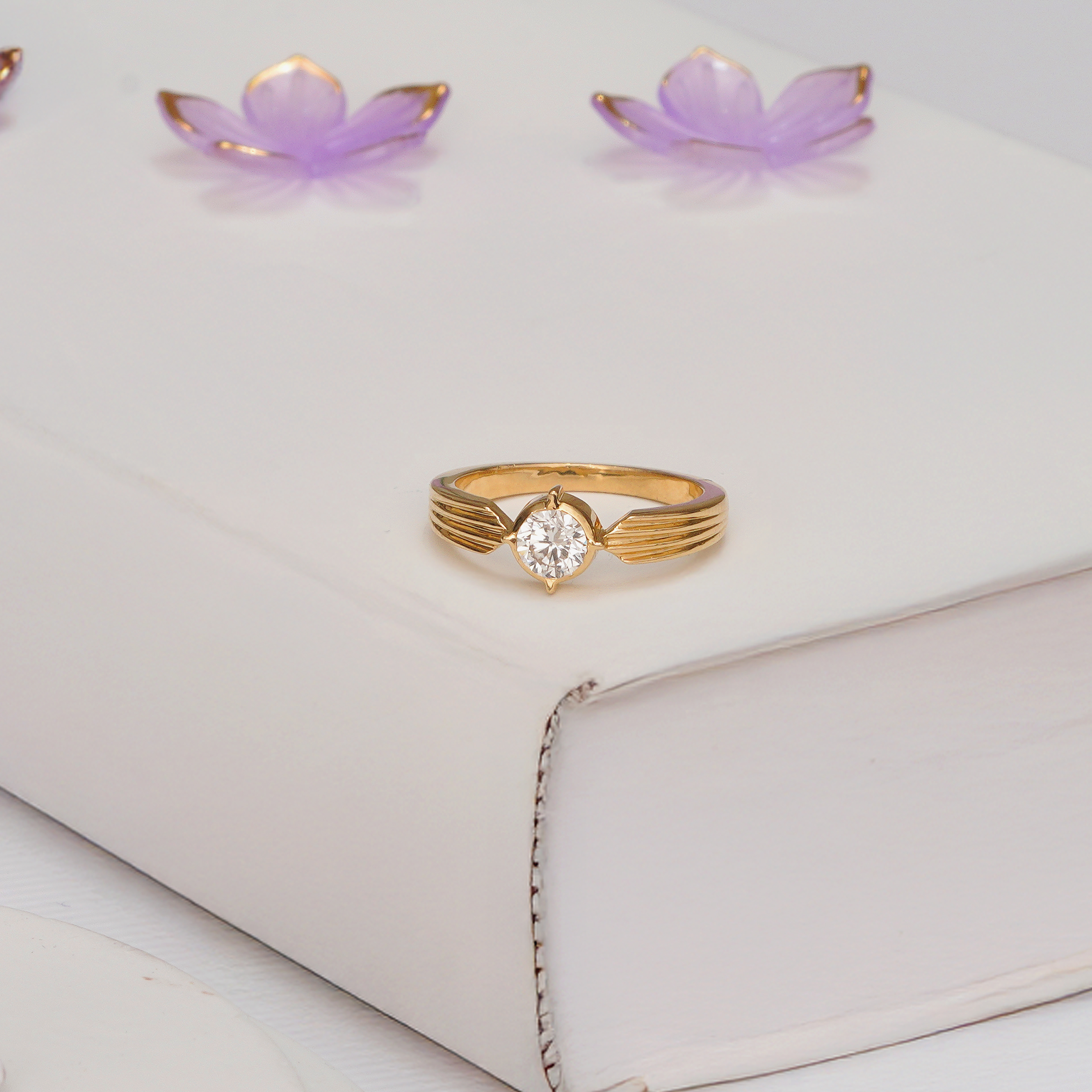 Celestia Compass Solitaire Diamond Ring with round diamond and ribbed yellow gold band