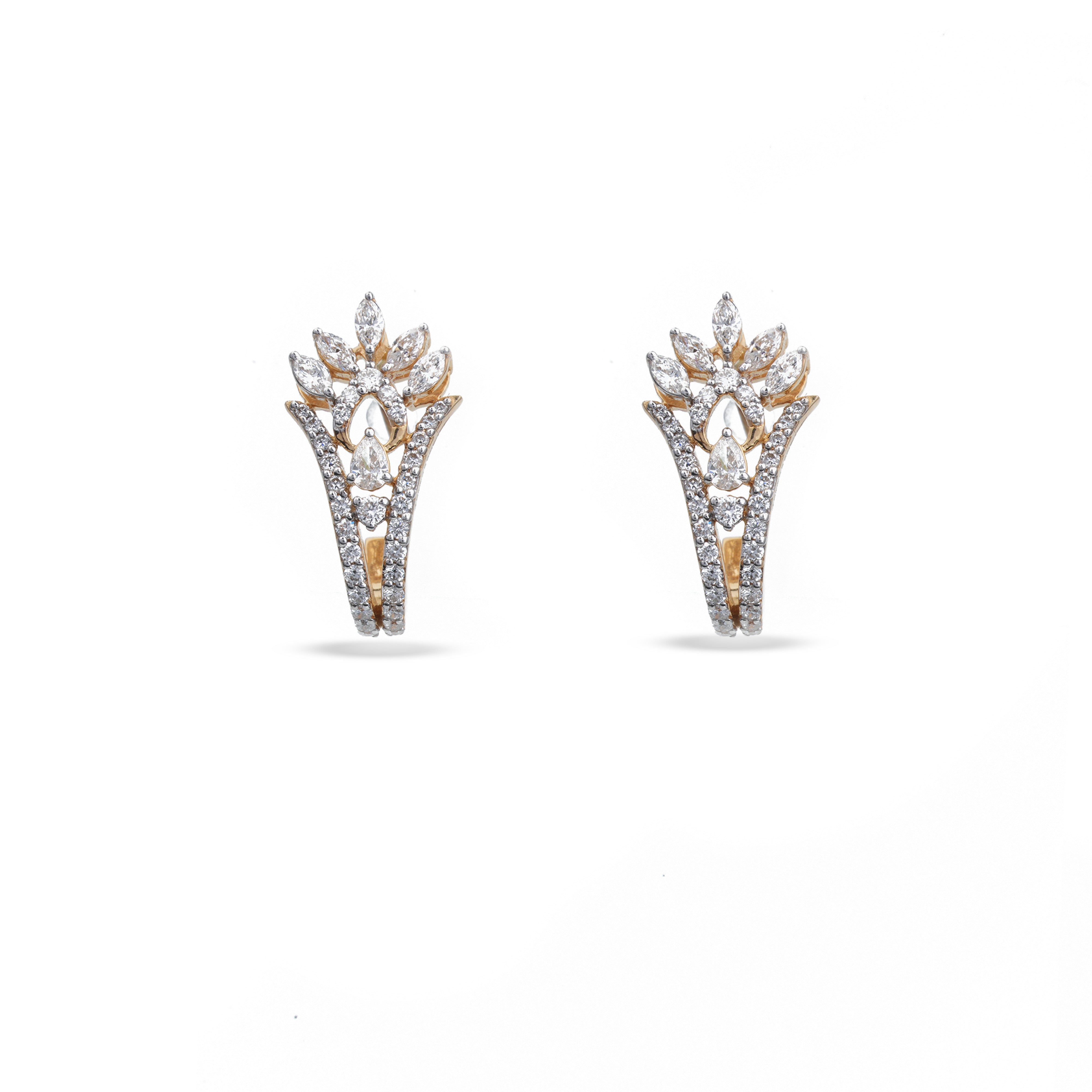 A pair of gold and white gold huggie hoop earrings adorned with pavé-set clear crystals, shown against a plain white background.
