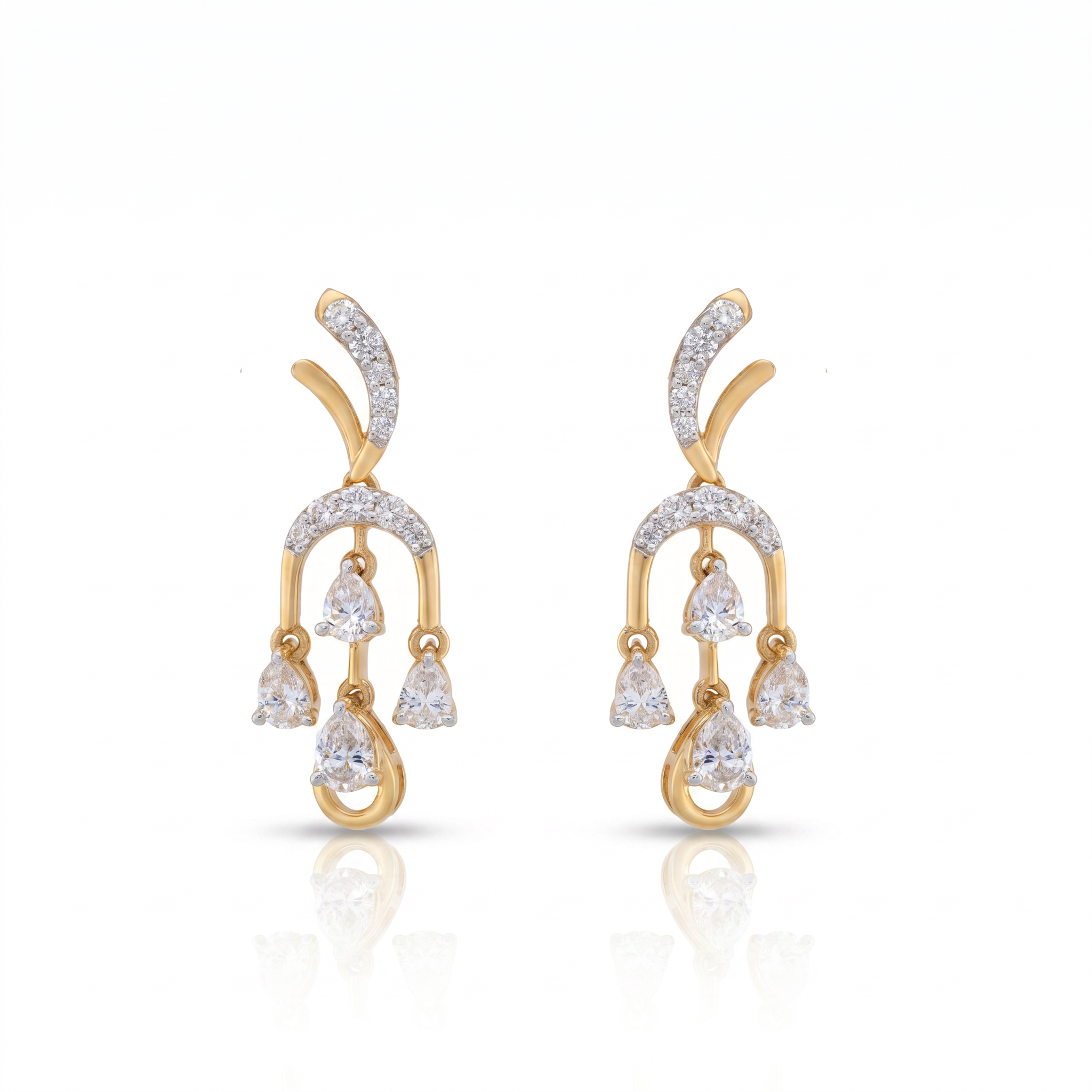 Gold and diamond earrings on a white background
