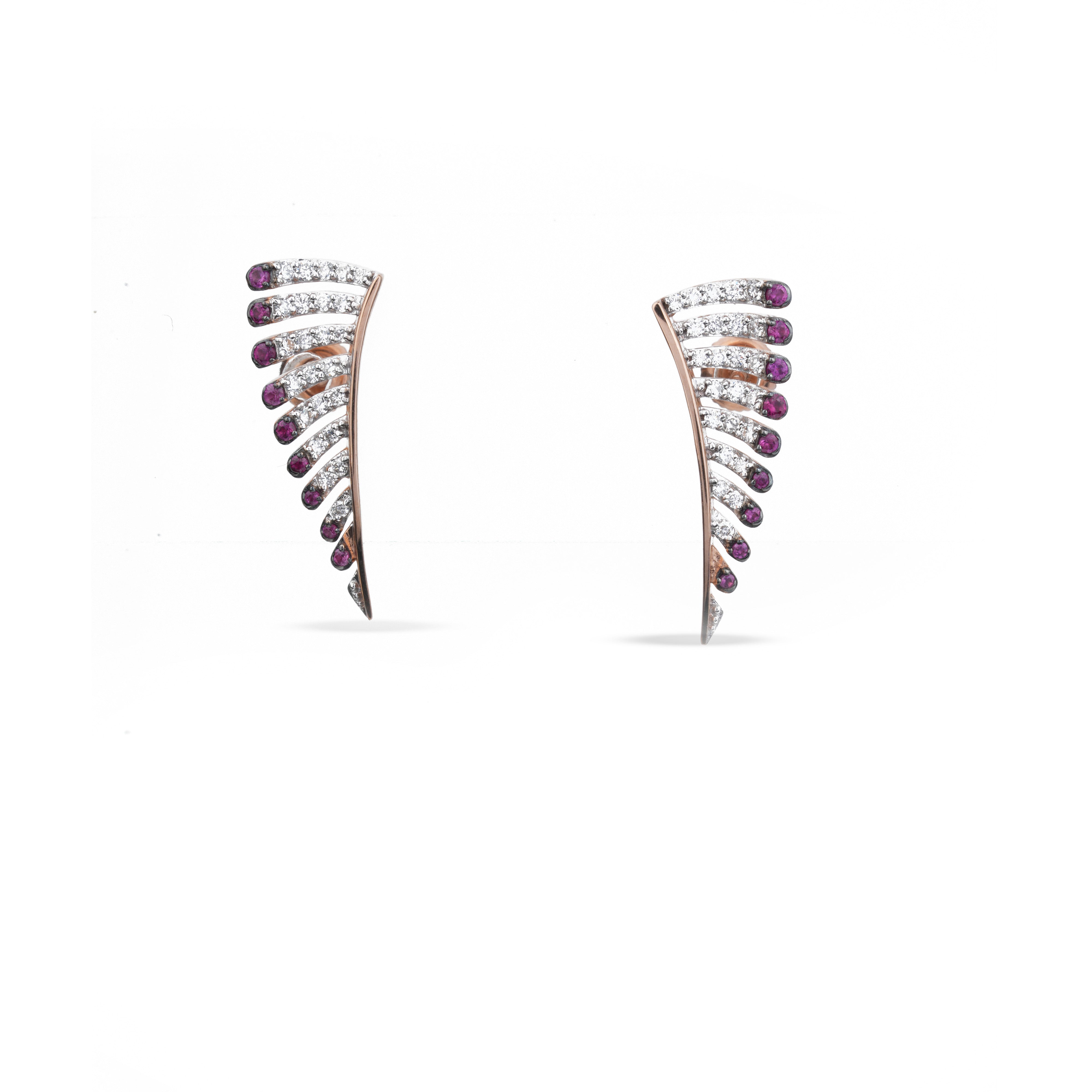 A pair of curved, fan-shaped stud earrings in rose gold, featuring rows of clear pavé stones and small round purple gemstones along the outer edges, set against a plain white background.
