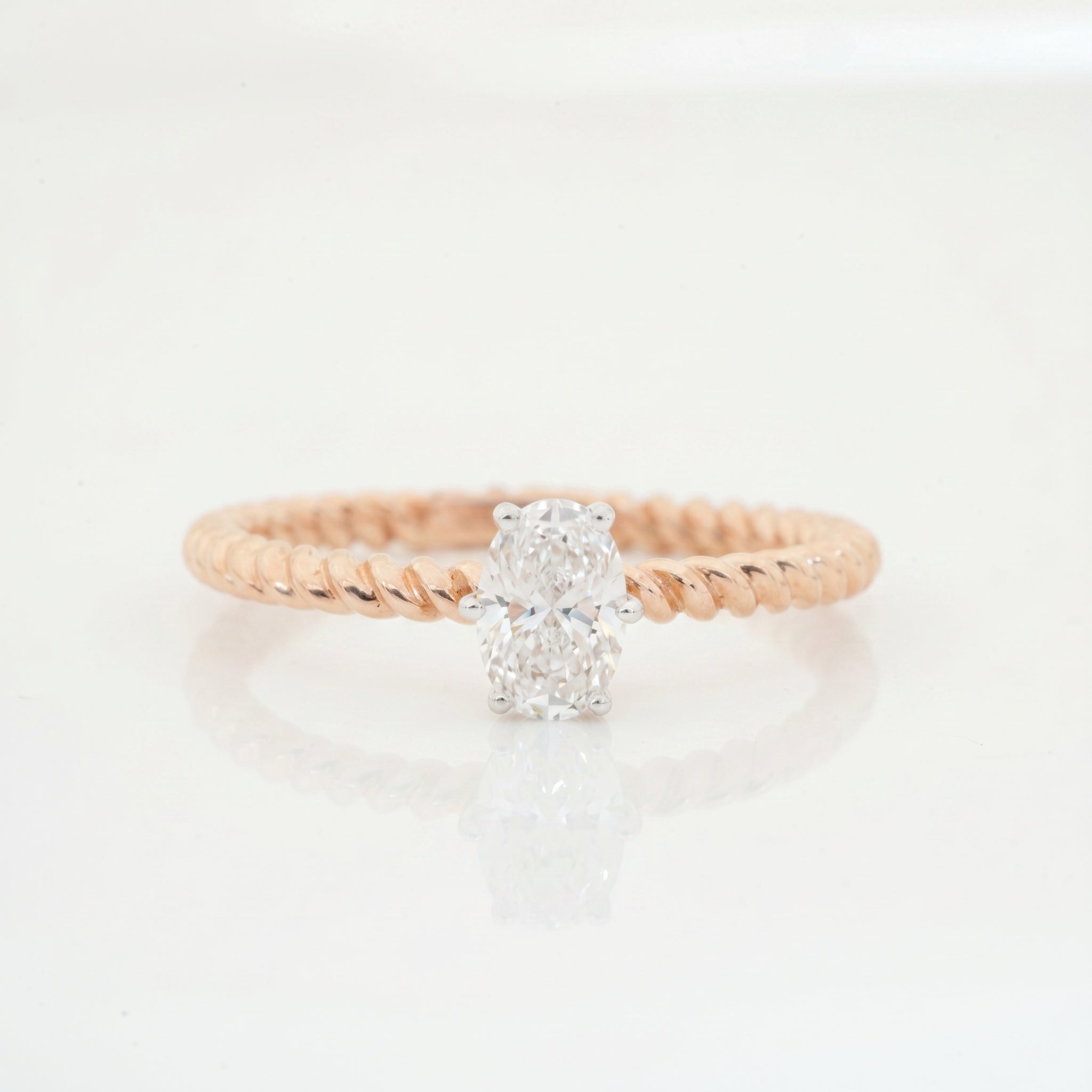 Oval Cut Lab Grown Diamond Solitaire Ring with Twisted Band