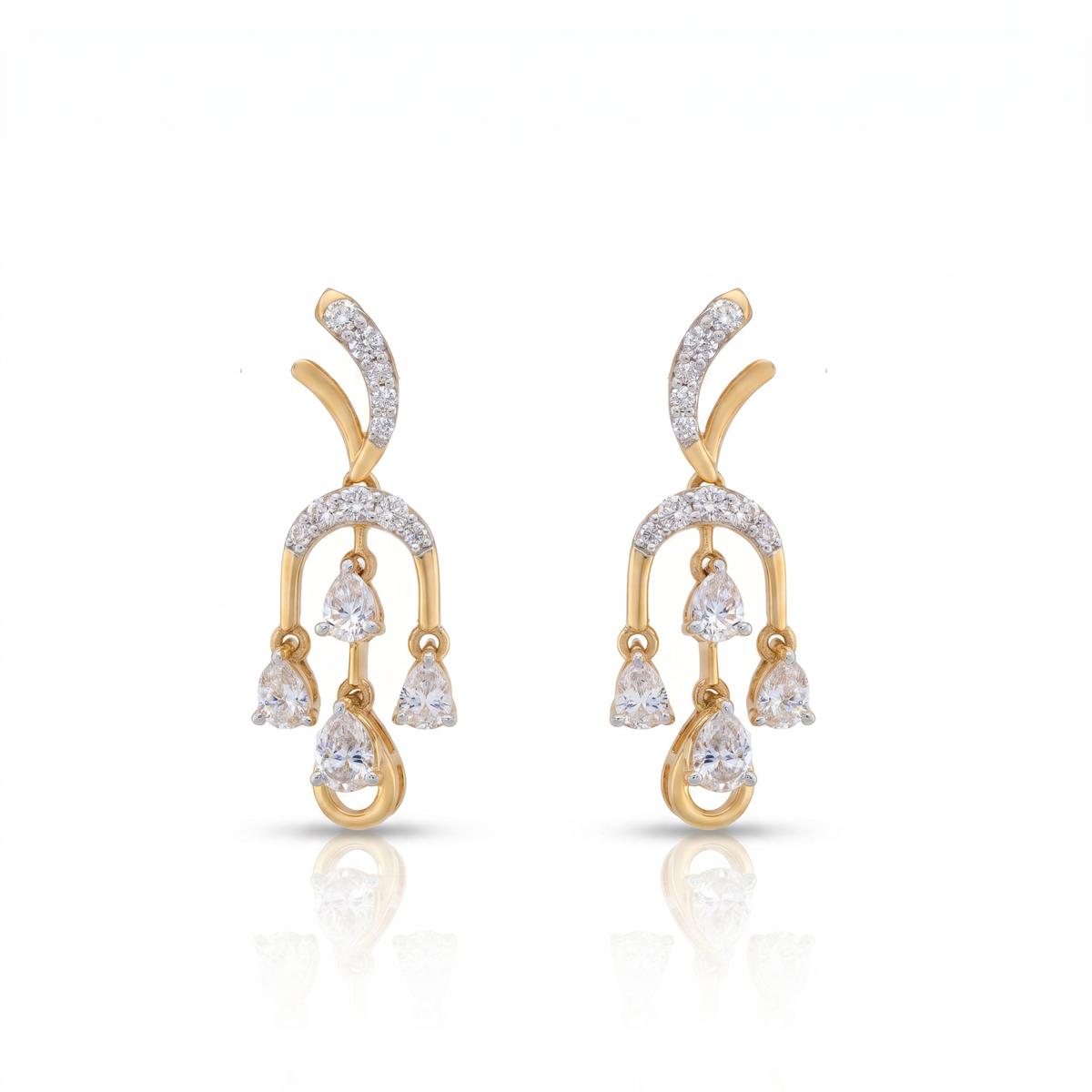 Gold and diamond earrings on a white background