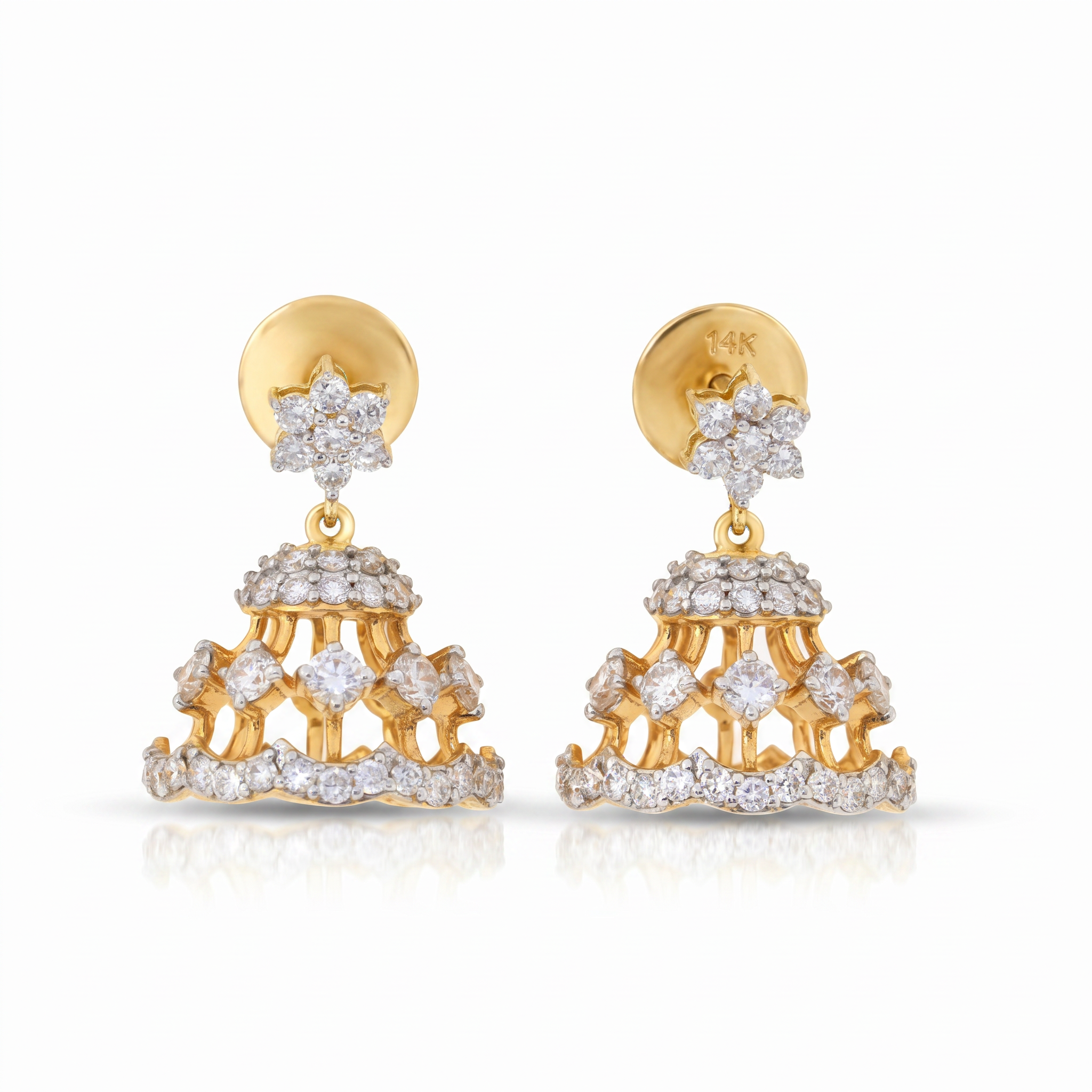 Gold and diamond earrings on a white background