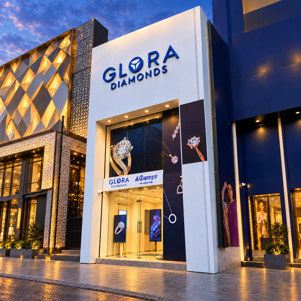 Twilight frontage render of Glora Diamonds showroom in T. Nagar, Chennai, showing the illuminated entrance and blue logo
