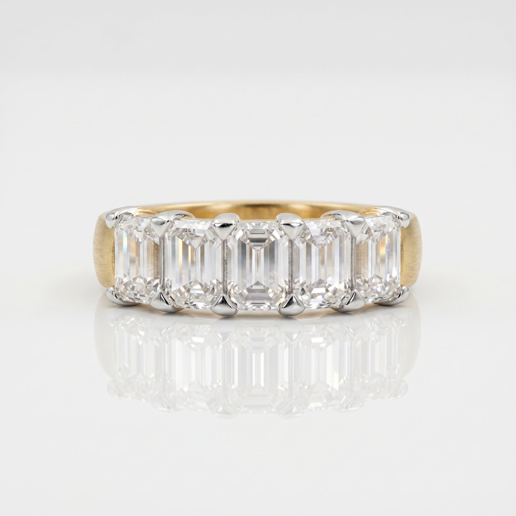 Emerald cut lab grown diamond eternity band ring with step-cut diamonds by Glora Diamonds Chennai