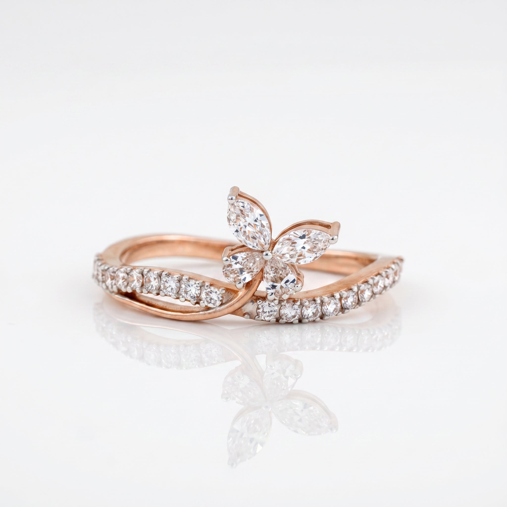 Marquise cut lab grown diamond butterfly ring with round brilliant pavé diamonds and twisted band in rose gold by Glora Diamonds Chennai