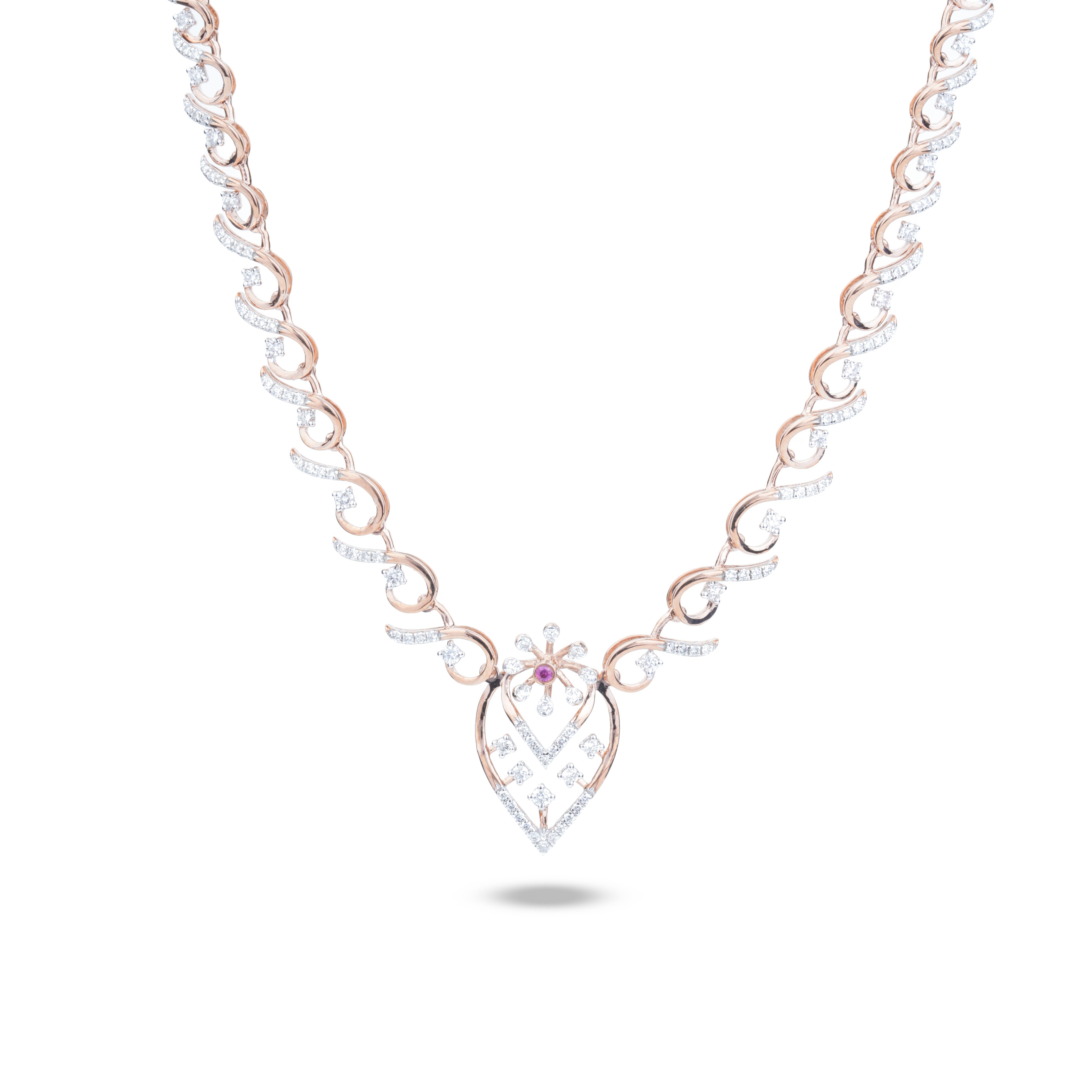 A delicate necklace with a rose gold chain featuring pavé-set clear stones and a central teardrop-shaped pendant with a small pink gemstone accent, shown on a white background.