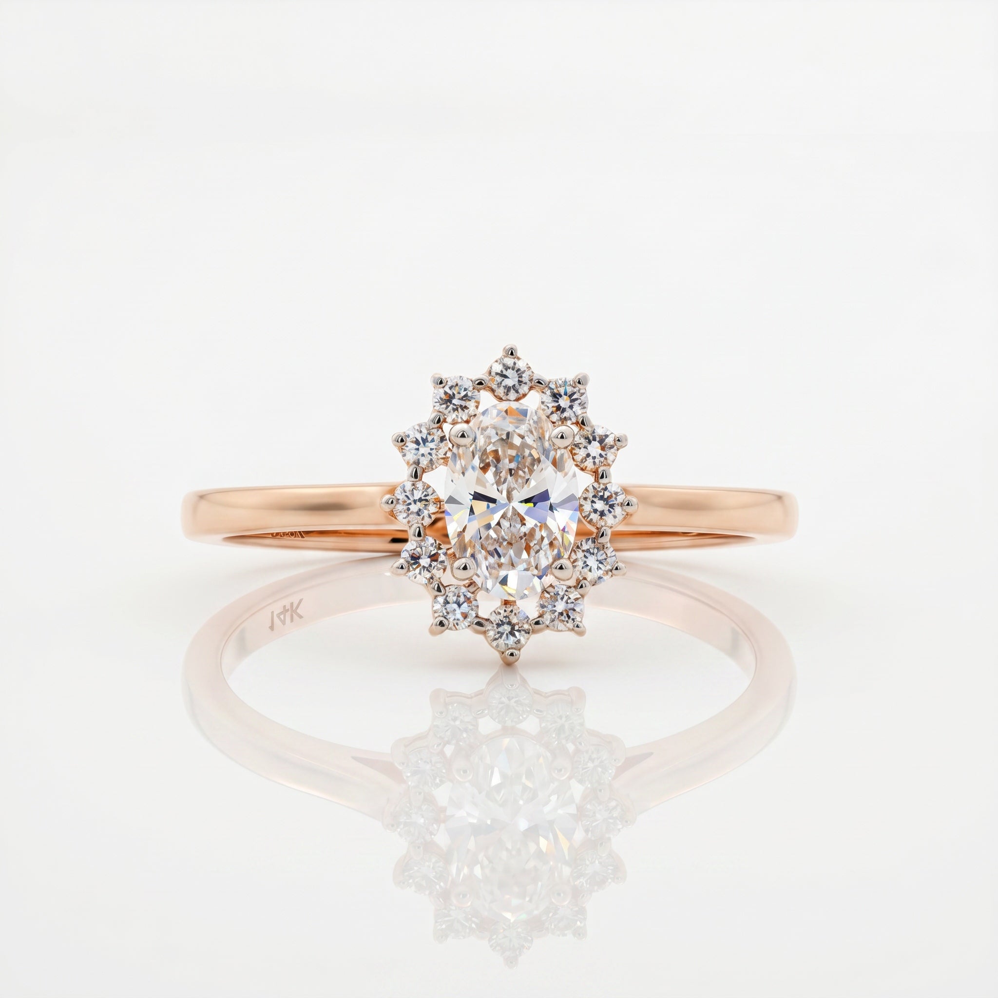 Oval cut lab grown diamond ring with round brilliant halo diamonds in rose gold by Glora Diamonds Chennai
