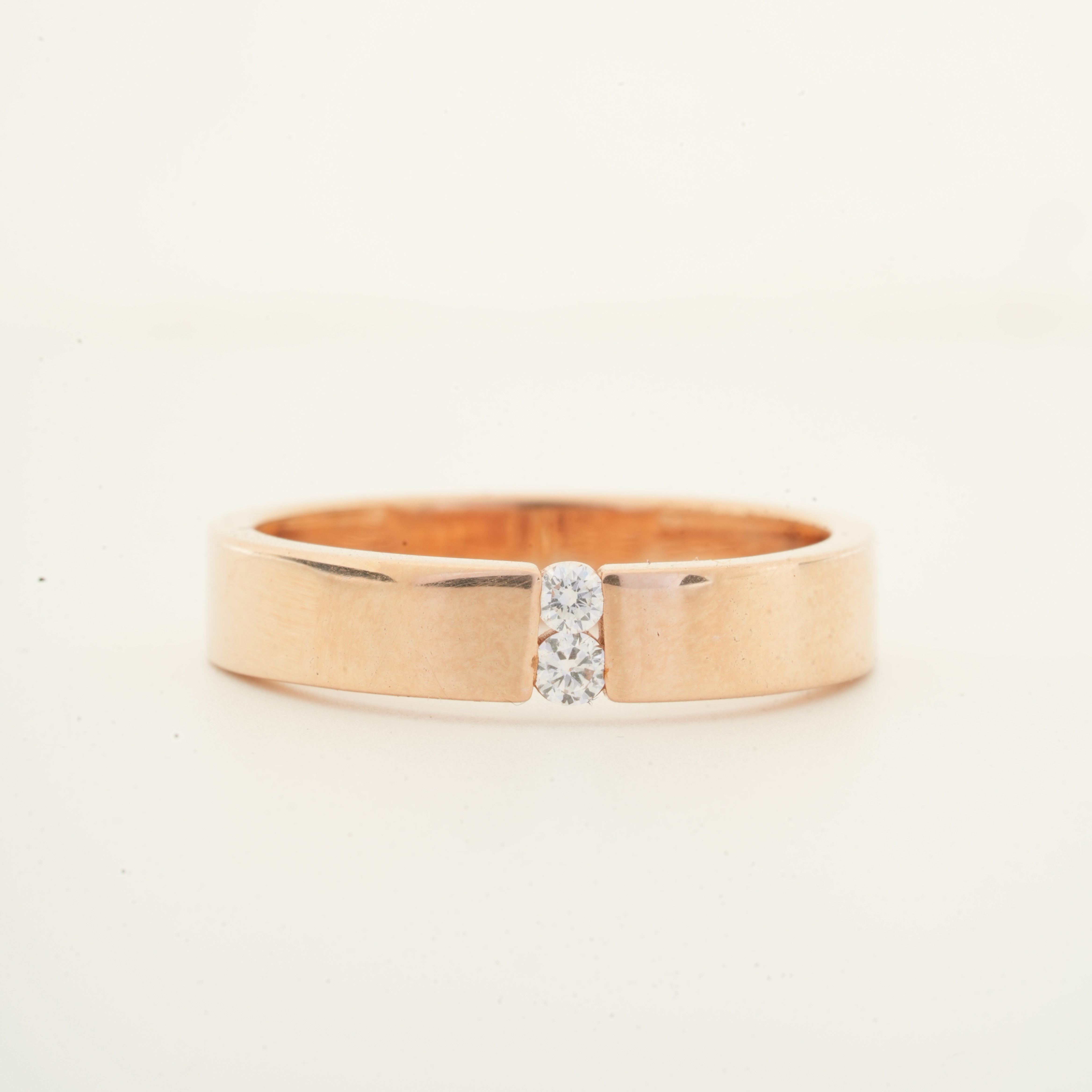 Round brilliant twin diamond signature band ring with polished gold band by Glora Diamonds Chennai