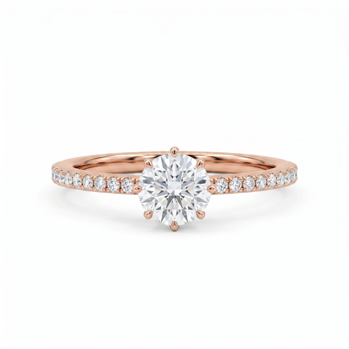 A rose gold engagement ring featuring a round brilliant-cut center stone and a pavé-set diamond band, shown on a clean white background.