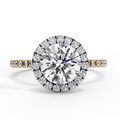 A round diamond ring with smaller diamonds around it, set in a gold band.
