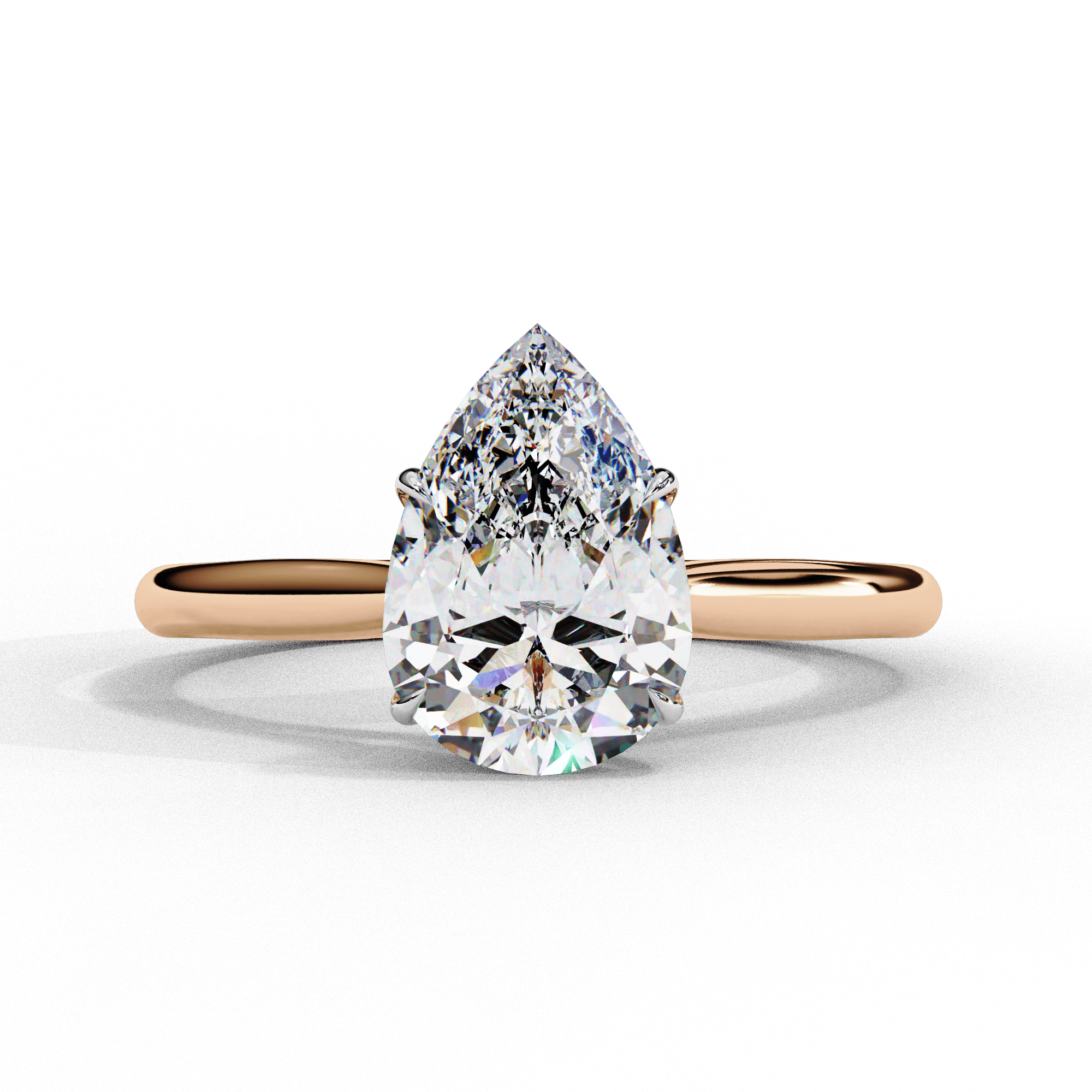 A solitaire diamond ring with a rose gold band and a large clear diamond centerpiece.