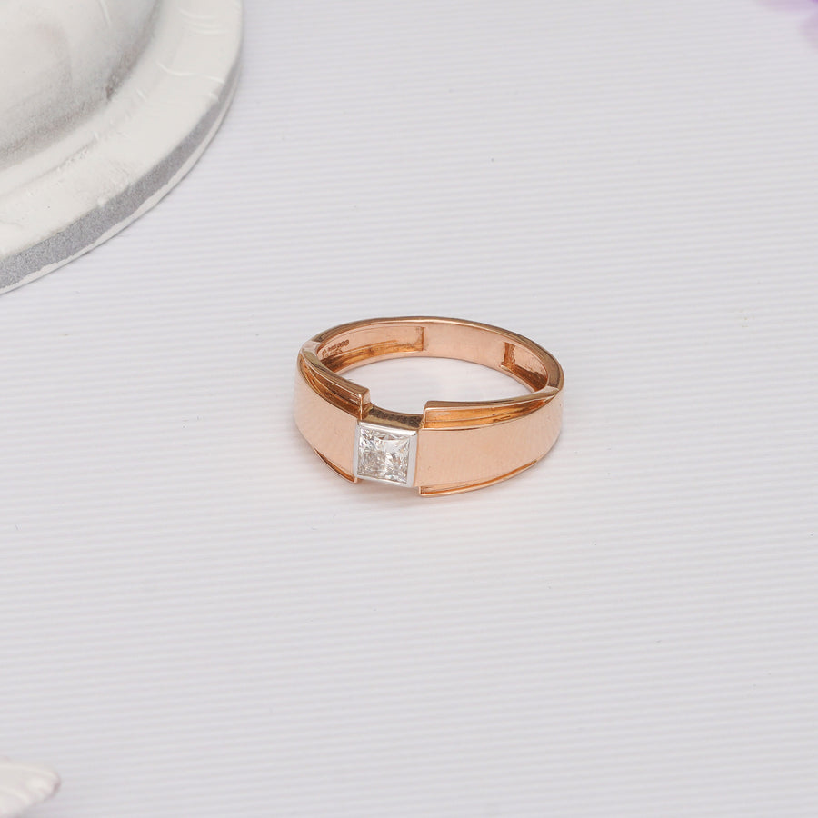 Rose gold ring with a diamond on a light gray background. Aries Men's Princess Lab Grown Diamond Band
