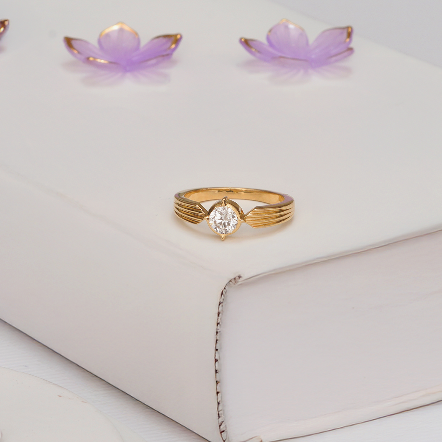 Celestia Compass Solitaire Diamond Ring with round diamond and ribbed yellow gold band