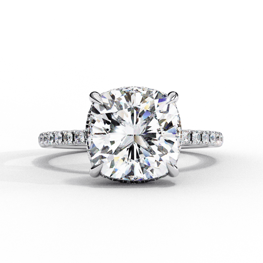 A round diamond ring with a white gold band, surrounded by smaller diamonds set in a ring.