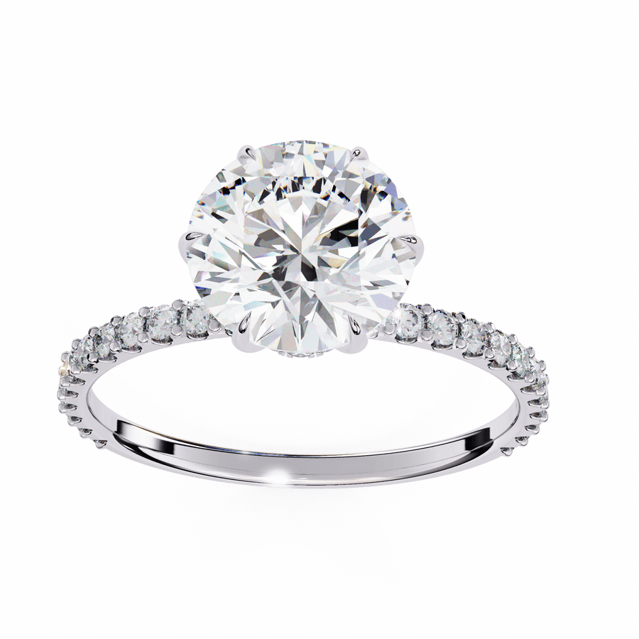 A round diamond ring with a white gold band and smaller diamonds set around the top edge.