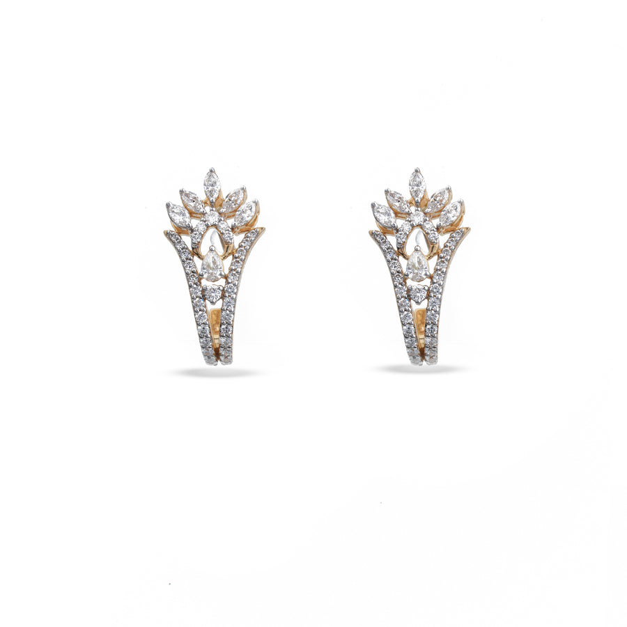 A pair of gold and white gold huggie hoop earrings adorned with pavé-set clear crystals, shown against a plain white background.