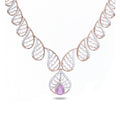 Rose Gold Diamond Necklace with leaf-inspired diamond design and pear-shaped pink gemstone pendant.
