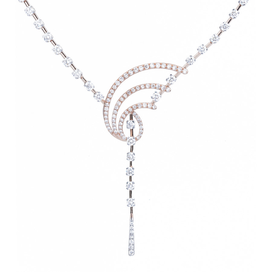 A delicate Y-shaped necklace featuring a central triple-curve pendant pavé-set with clear round stones, flanked by matching clear stone chain segments on a plain white background.