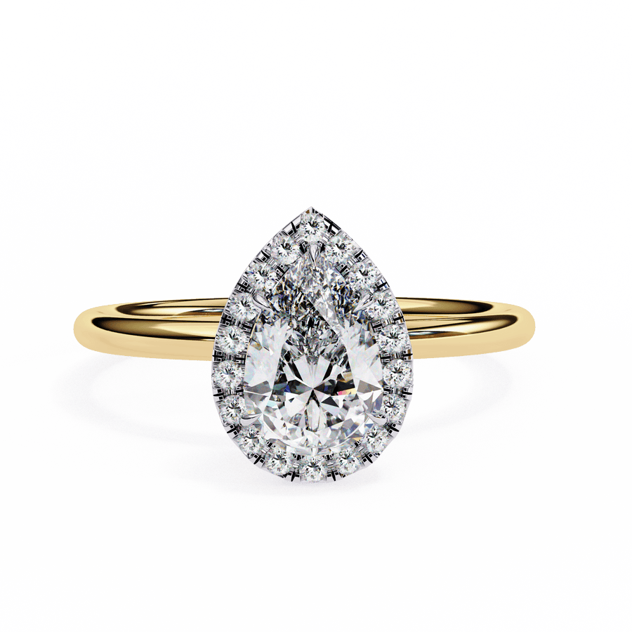 A pear-shaped diamond ring with a halo of smaller diamonds set in a yellow gold band.