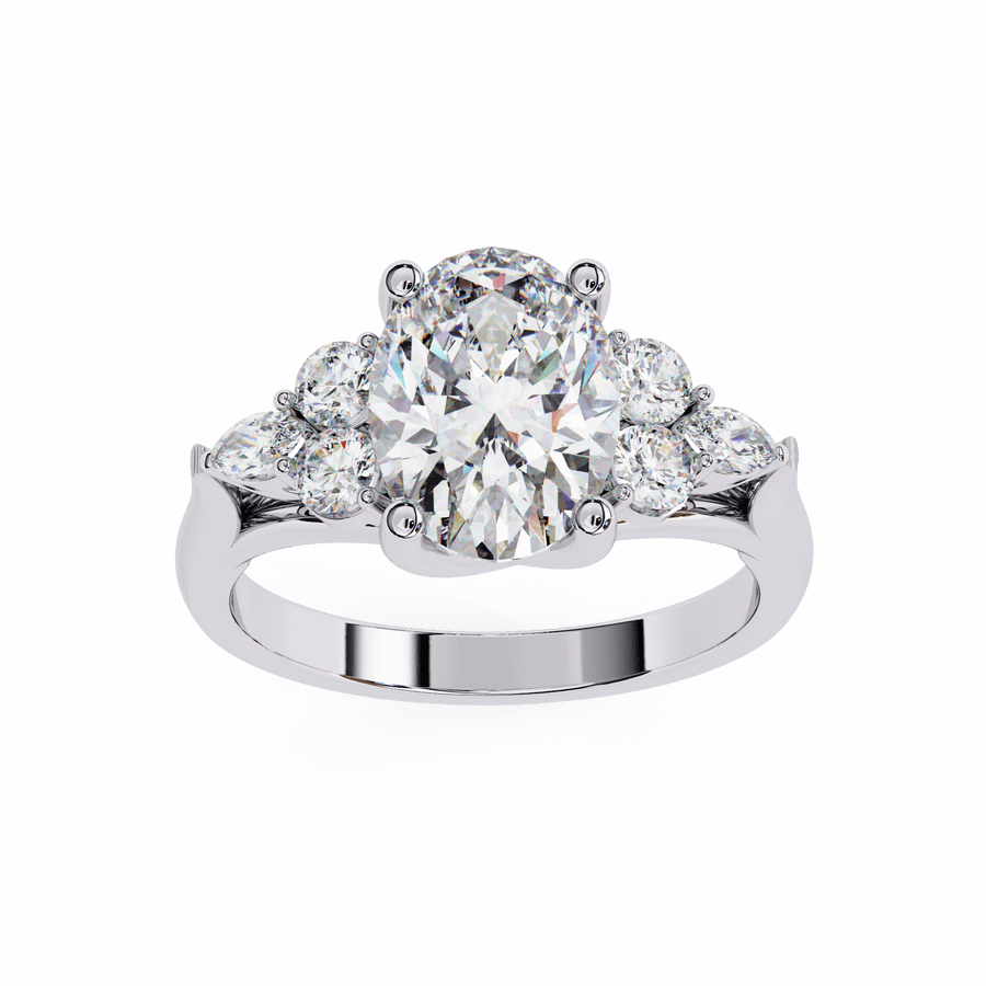 A silver-colored band diamond ring with multiple stones on the sides and a larger central diamond.