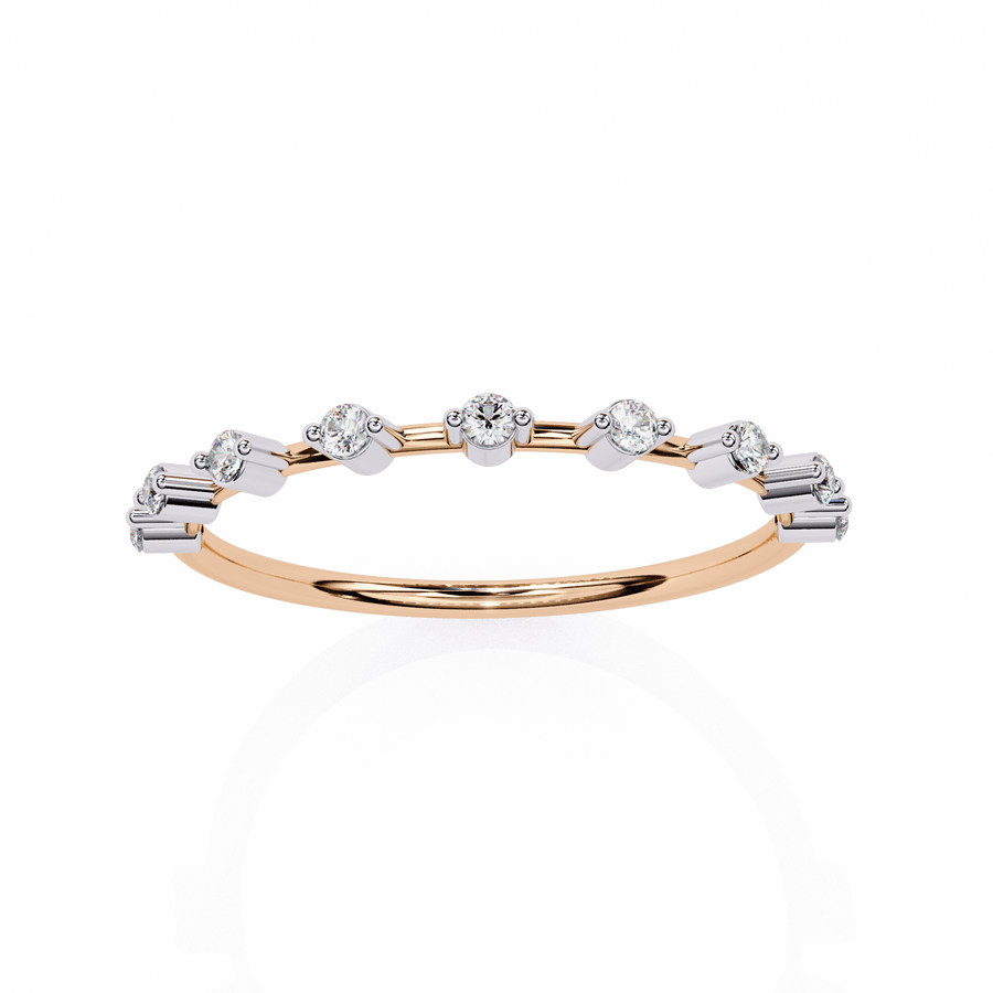 A diamond ring with multiple stones set in a gold band, displayed against a white background.