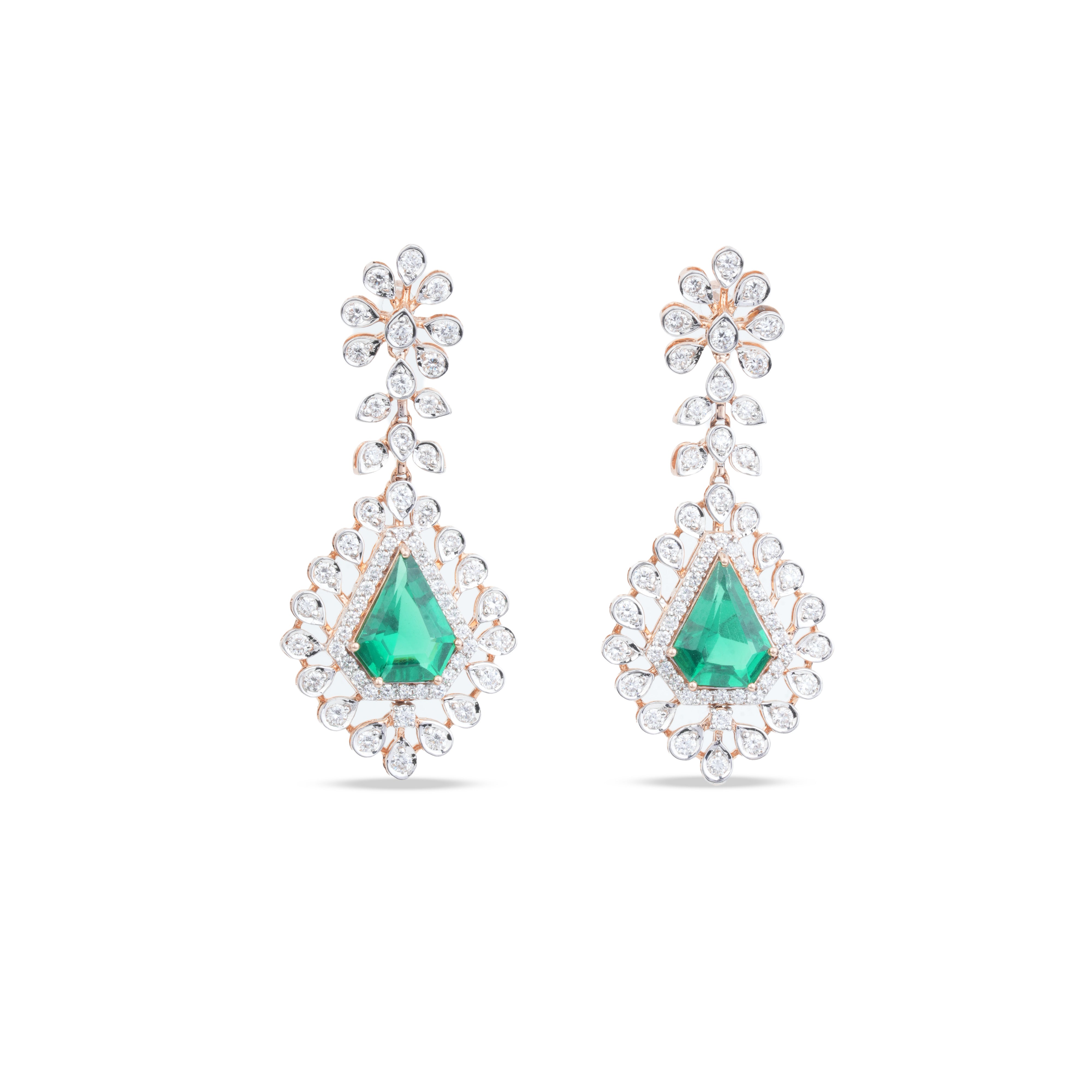 A pair of teardrop-shaped drop earrings featuring a central green emerald-cut stone surrounded by clear pavé stones, with floral studs above, set in a silver-toned metal on a white background.